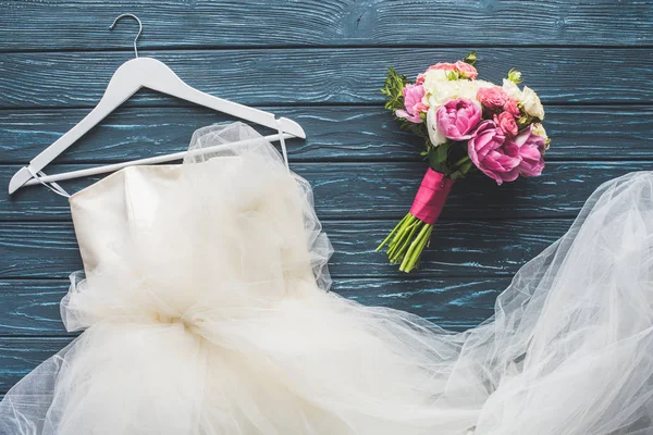 Angry bride tries to cut up wedding dress after being suspected of cheating