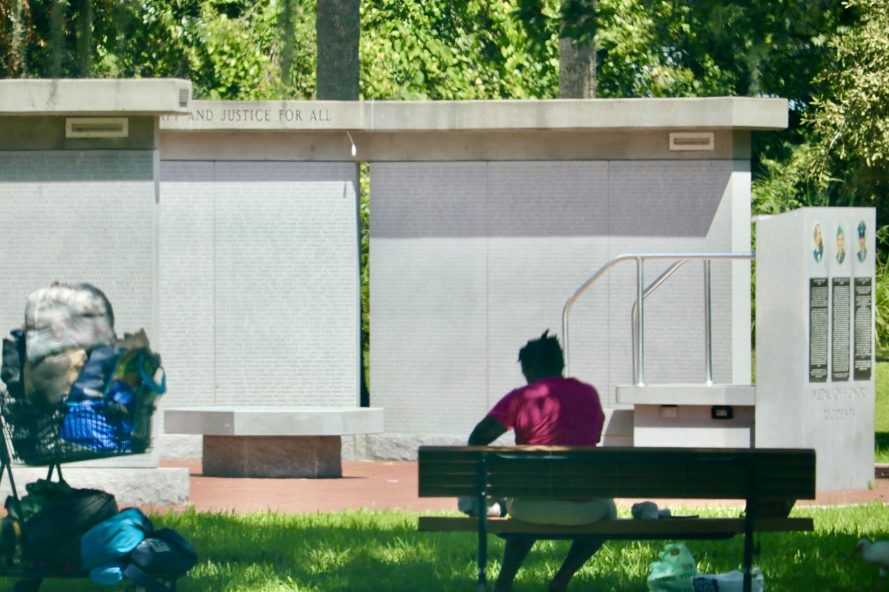 A homeless woman with her belongings in Veterans Memorial Park across from Leesburg City Hall. 2